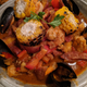 African Seafood Stew. I appreciate a blistered corn cob.